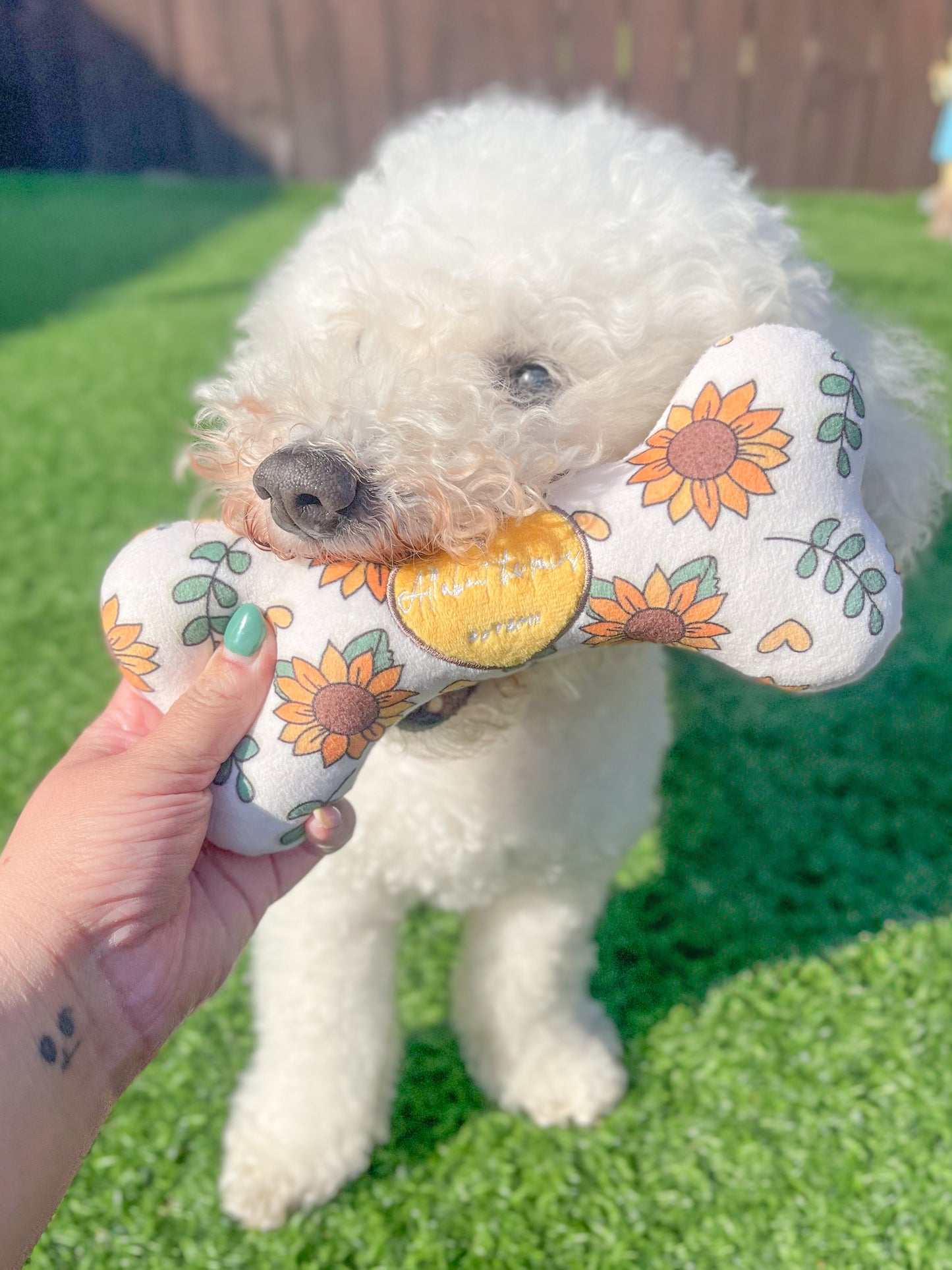 The Leah Smith sunflower branded all about the paws by TSPH dog toy bone